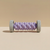Rouleau de massage plantaire, coloris violet : rouleau central lilas et roues d'extrémité gris clair nervurées